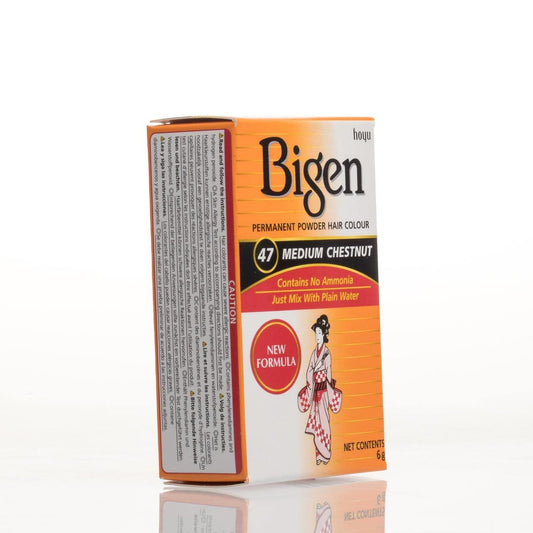 A box of Bigen Permanent Powder Hair Colour in shade 47 Medium Chestnut, shown standing upright on a white reflective surface against a white background.