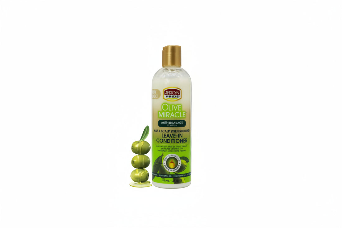 Olive Miracle leave-in conditioner bottle with green foliage and butterfly in the background
