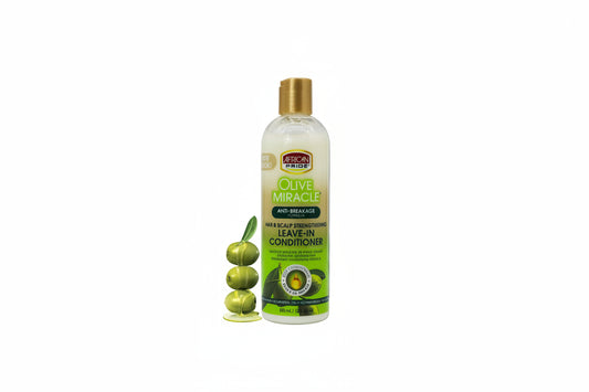 Olive Miracle leave-in conditioner bottle with green foliage and butterfly in the background
